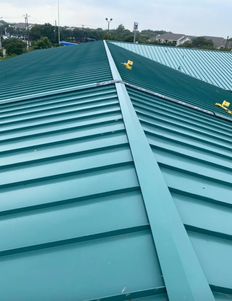 Green commercial metal roof ridge and valley for Metal Roof Repair in Bourbonnais