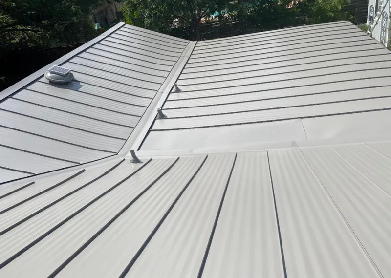 Solar attic fan installed on a metal roof for Roof Ventilation in Bourbonnais